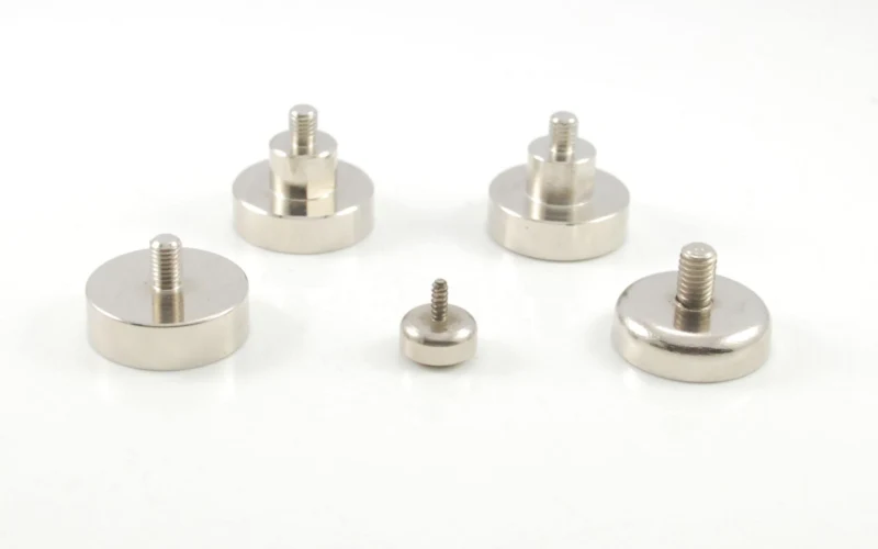 Pot magnet assemblies for clamping and lifting