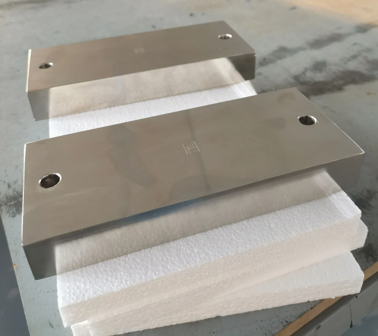 Rectangular magnetic assemblies with machined faces and mounting holes