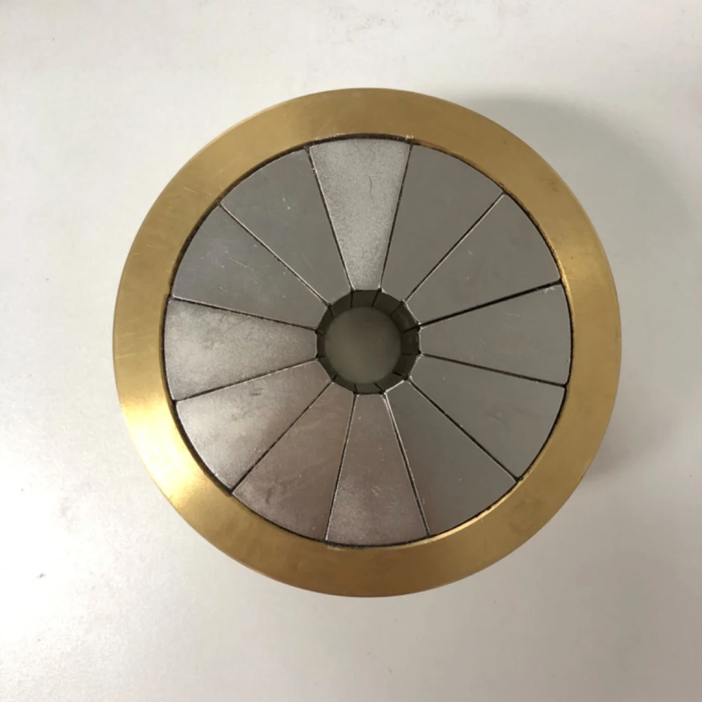 Halbach Arrays Prototype Manufacturing — Example of an assembled segmented ring in its supporting sleeve.